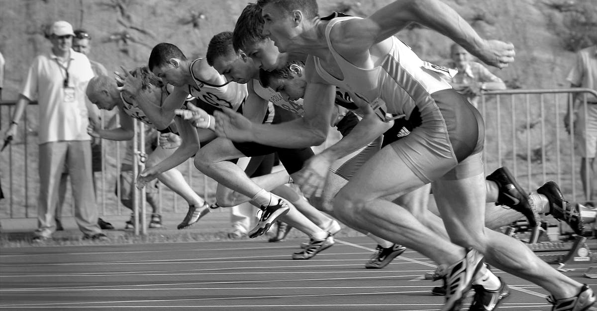 How do I start juicing? - Athletes Running on Track and Field Oval in Grayscale Photography