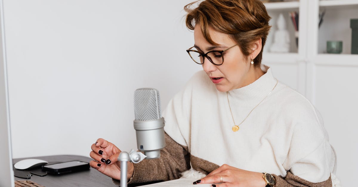 How do I tell if a rutabaga is fresh? - Female narrator in glasses reading out loud from book while sitting at desk with microphone and recording audiobook in cozy study