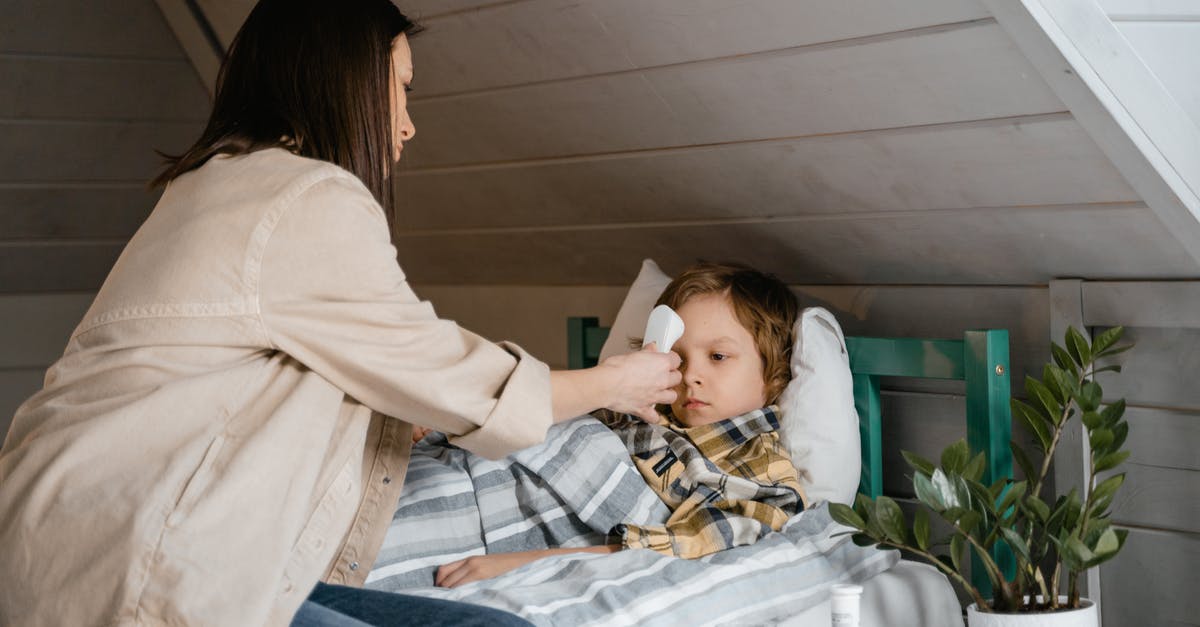 How do I temper an egg? - Woman Checking the Boy's Body Temperature