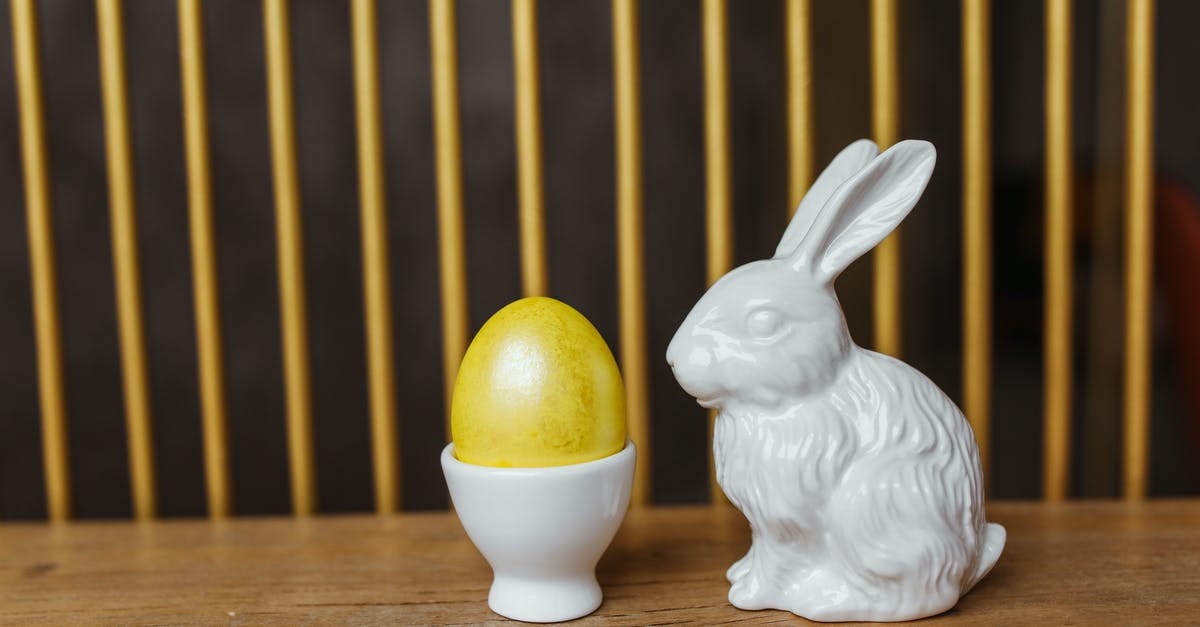 How do I temper an egg? - White Ceramic Rabbit Figurine on Brown Wooden Table