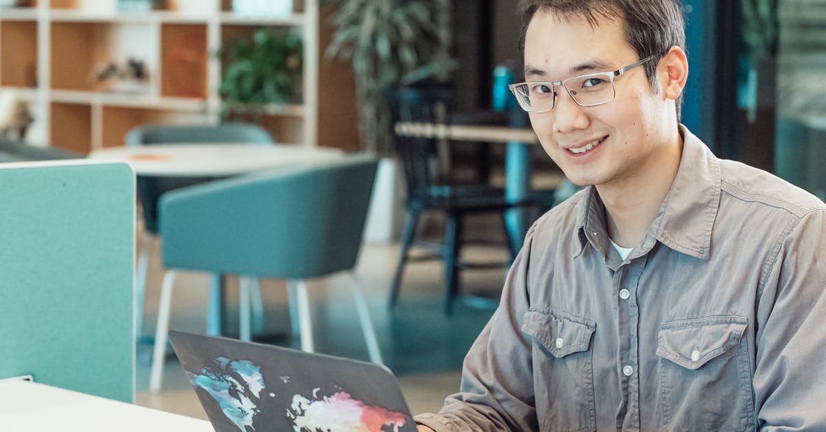 How do I use a Chinese spoon? - A Man in Gray Sleeves Using a Laptop