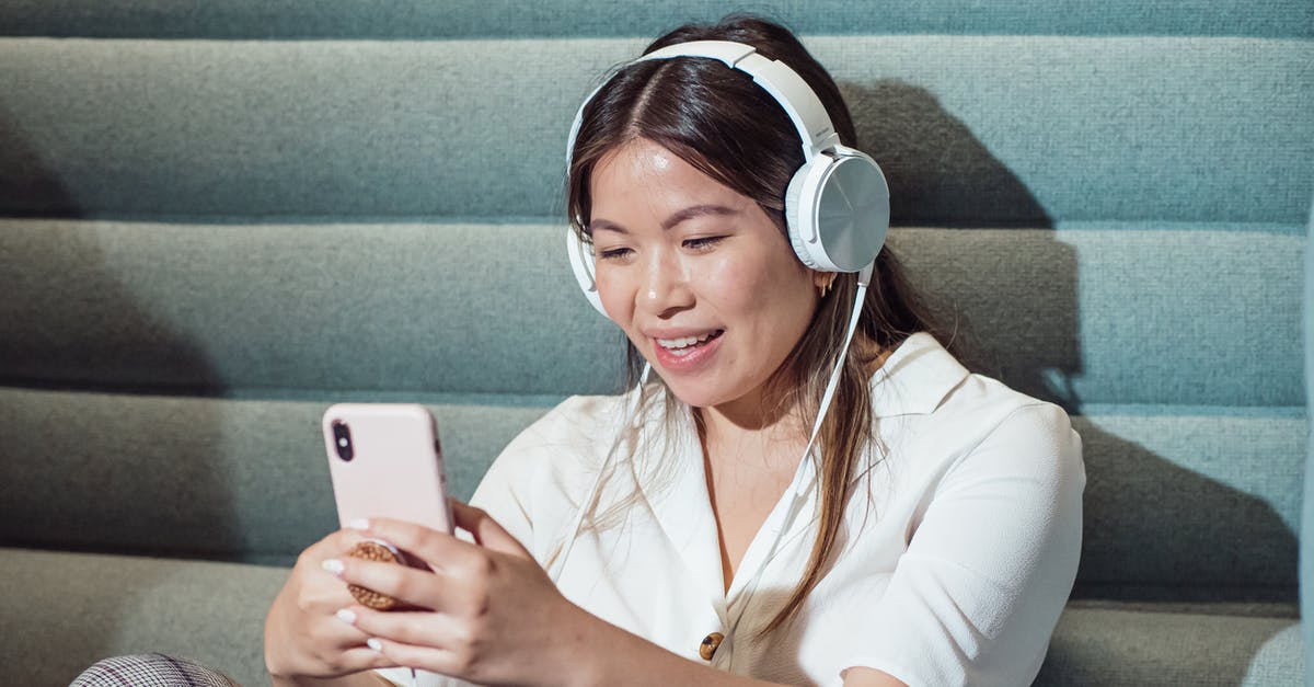 How do I use a Chinese spoon? - Woman Using Smartphone while Listening to Music