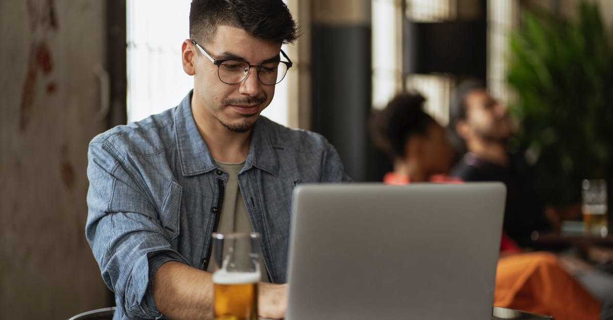 How do I use beer barm to make sourdough? - Man in Gray Dress Shirt Using Macbook