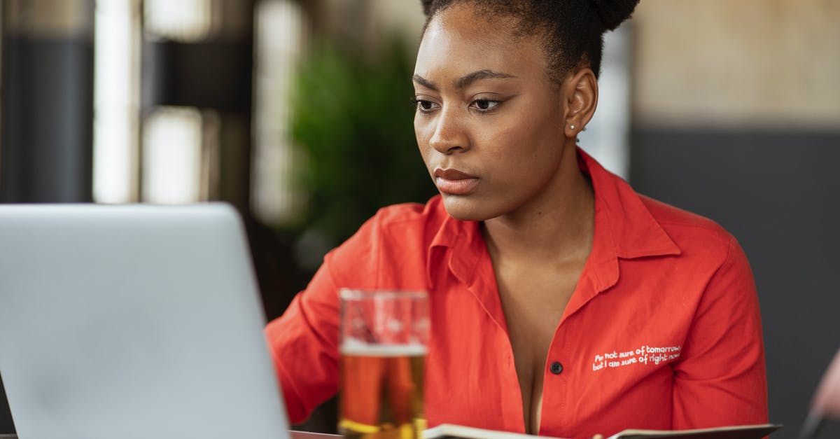 How do I use beer barm to make sourdough? - Woman in Red Blazer Using Macbook