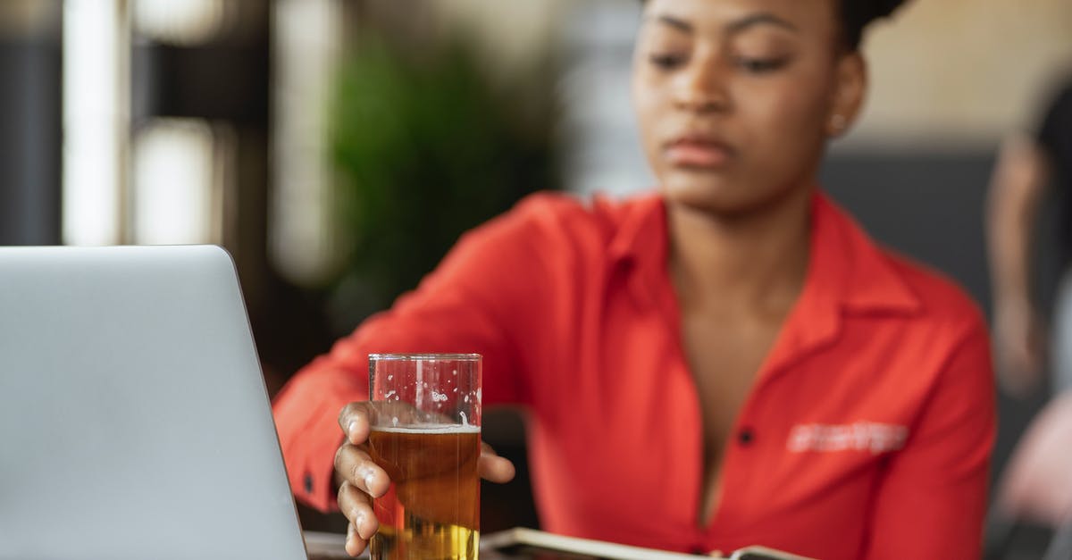 How do I use beer barm to make sourdough? - Man in Red Polo Shirt Using Macbook Pro