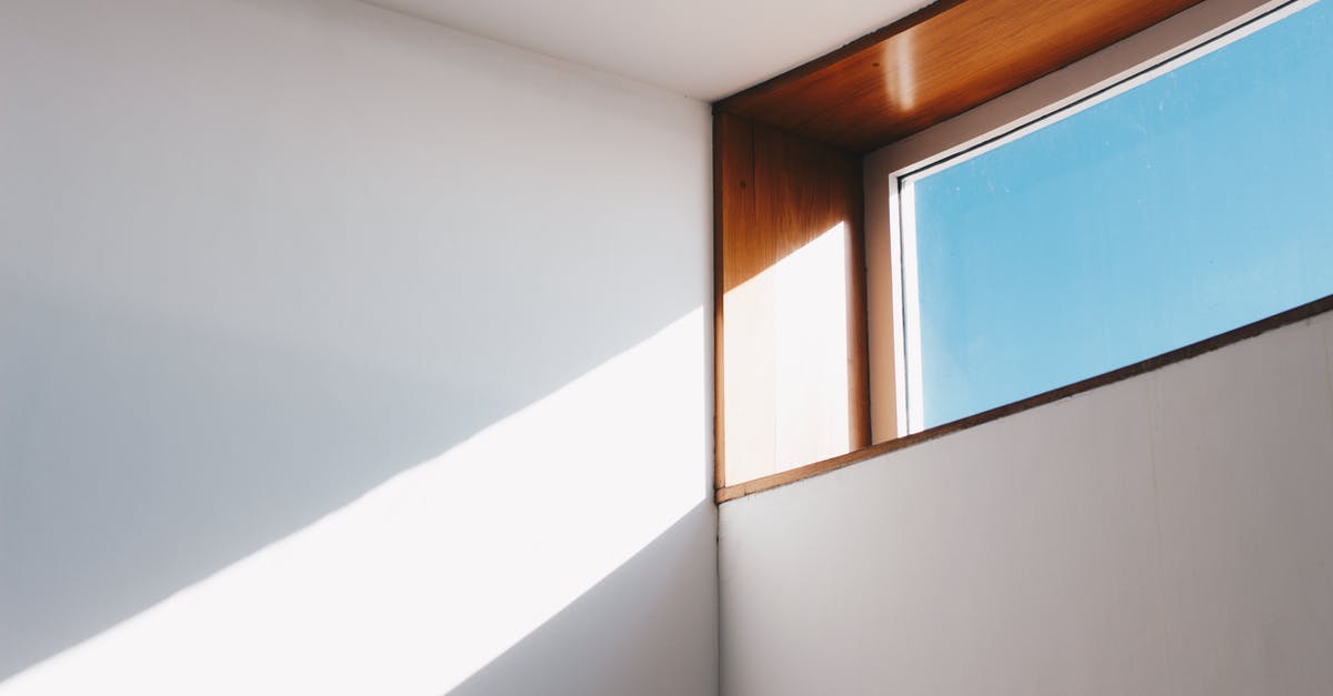 How do you get burned wood off of a glass stovetop? - Clear Glass Window With Brown and White Wooden Frame