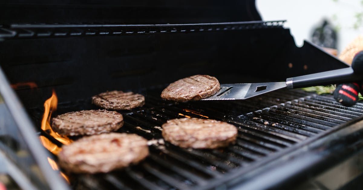 How do you grill a perfect burger? - Close-up Shot of a Grilling Burgers