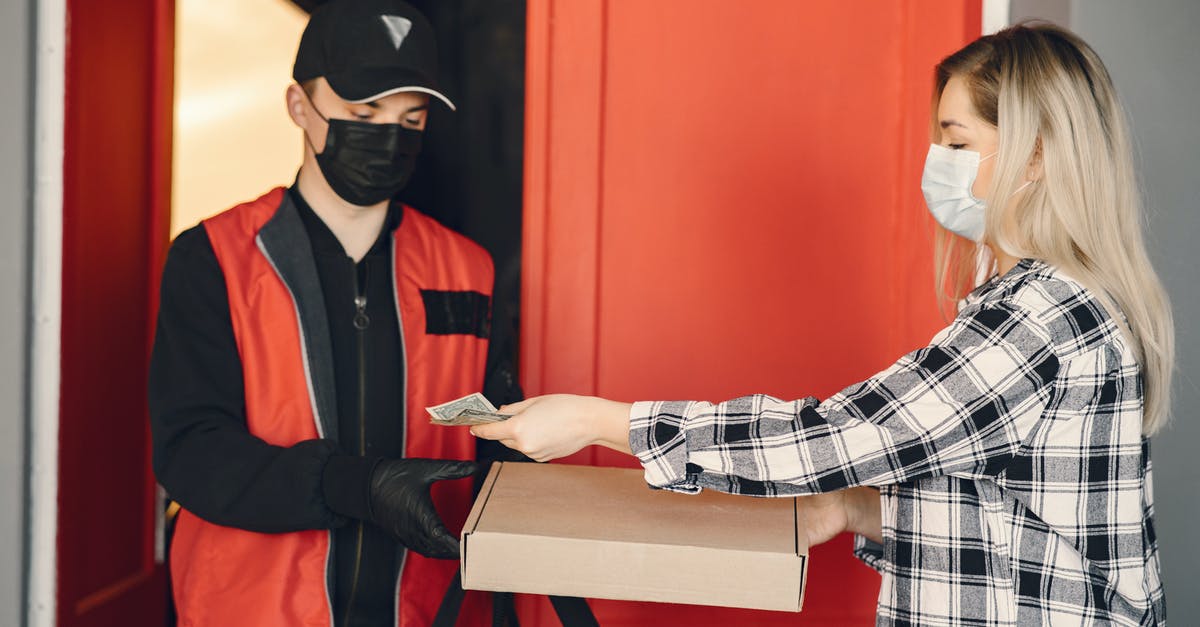 How do you protect a pizza peel? - Young female customer receiving pizza during coronavirus pandemic quarantine