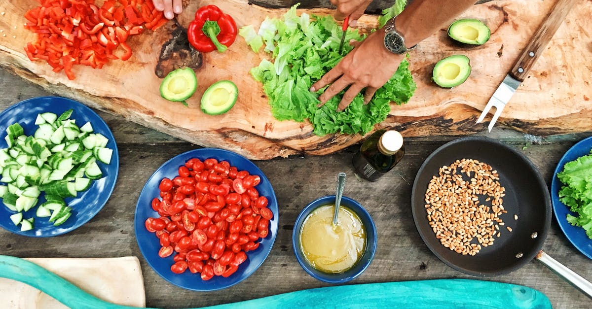 How do you quickly prepare tomatoes for pizza? - Person Holding Sliced Vegetable