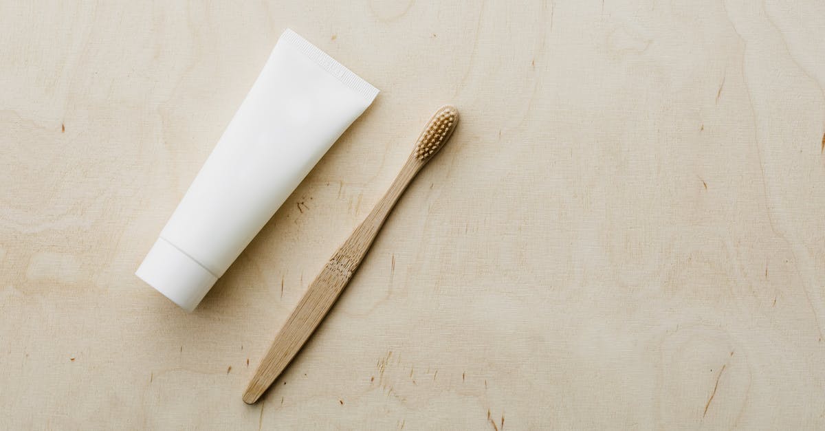 How do you reduce a cream sauce? - White tube and bamboo brush on wooden table