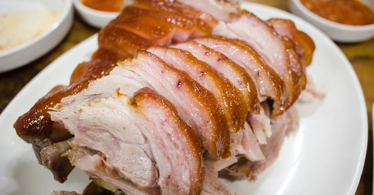 How do you score pork skin? - Slices of Fried Pork Belly on Serving Plate