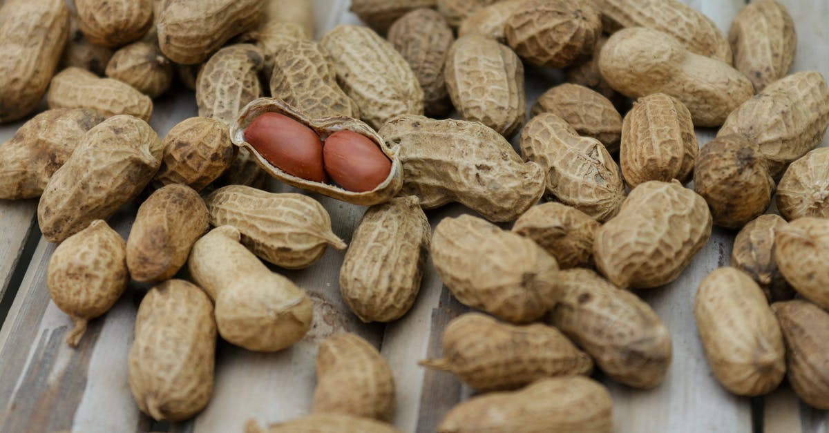 How do you shell groundnuts (peanuts) without breaking their kernels? - Close Up Photo of Peanuts