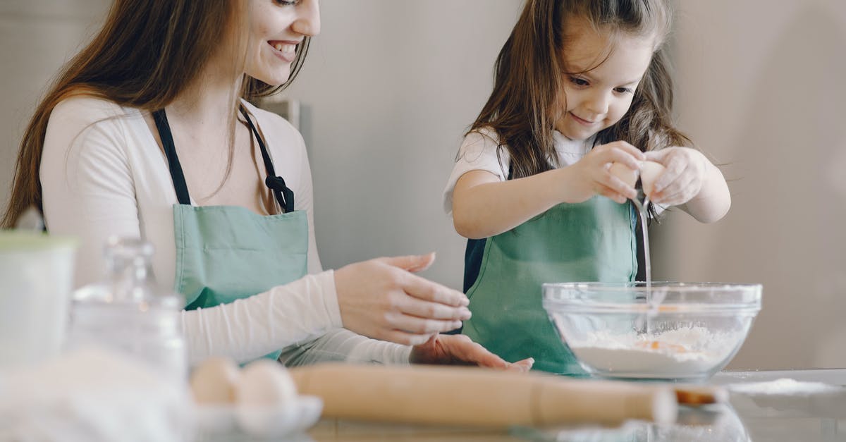 How does altering the fat-to-flour ratio affect the pastry? - Photo of Mom and Child Baking With Egg and Flour