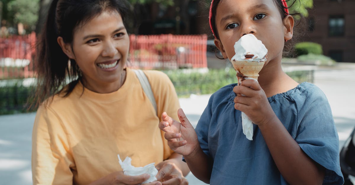 How does buttermilk affect a waffle recipe? - Asian happy mother looking at daughter eating ice cream