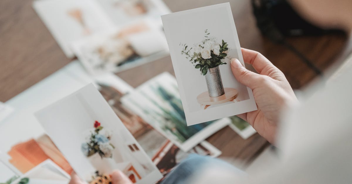 How does FPC compare to mammalian rennet? - From above of crop anonymous person comparing photos of floral bouquets at desk on blurred background