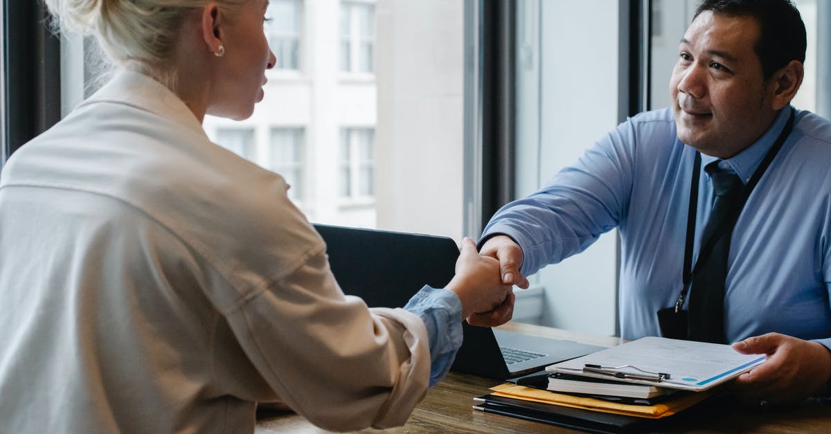 How does gelatin interact with grease (fat)? - Ethnic businessman shaking hand of applicant in office