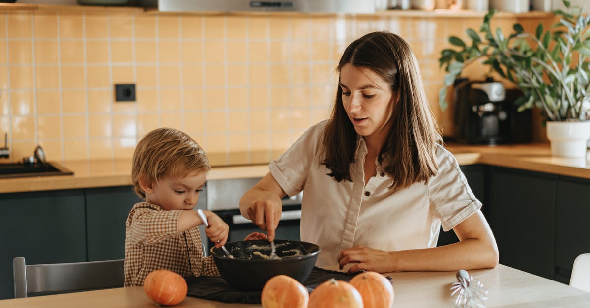 How does hydration of a sourdough affect baking features? - A Mother and Child Mixing a Dough