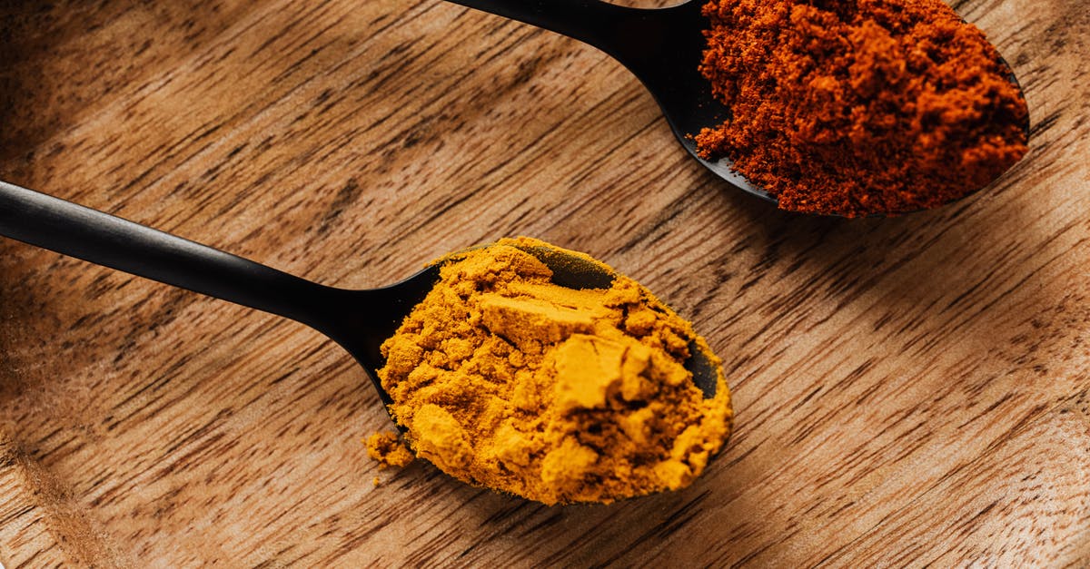 How does Korean chili powder differ from "US" chili powder? - Ground turmeric and hot paprika on cutting board