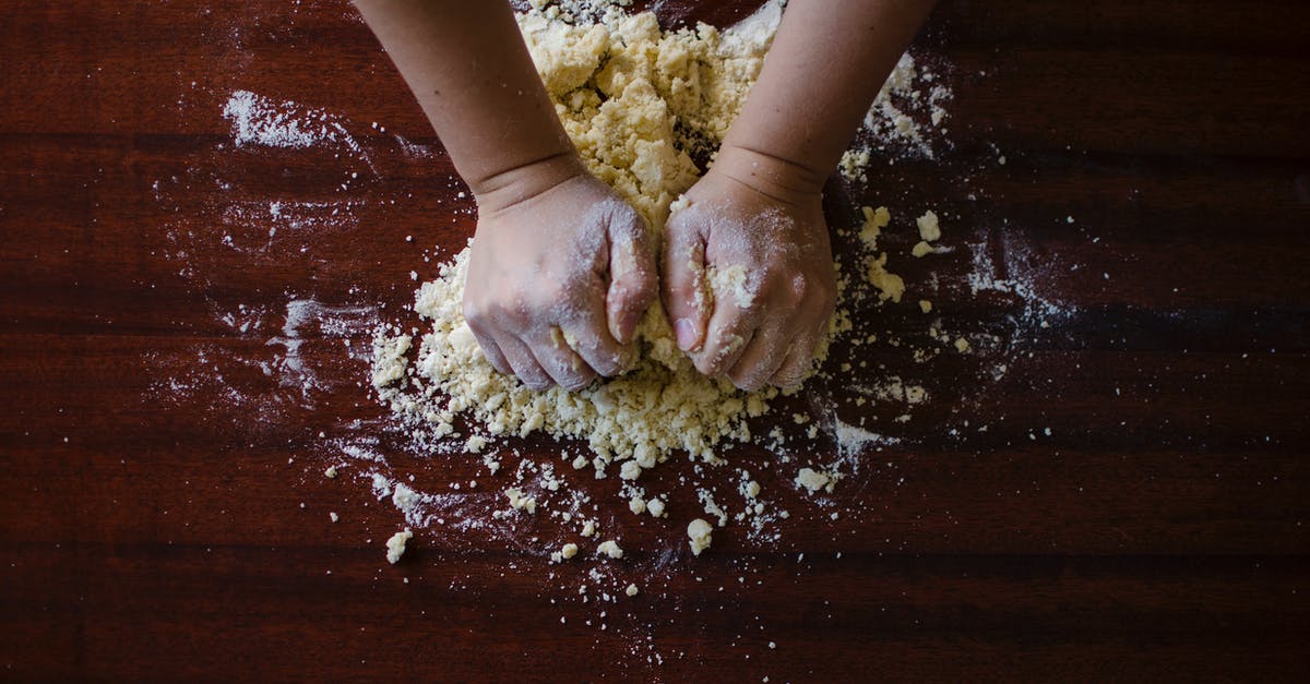 How does no-knead bread not overproof? - Person Mixing Dough