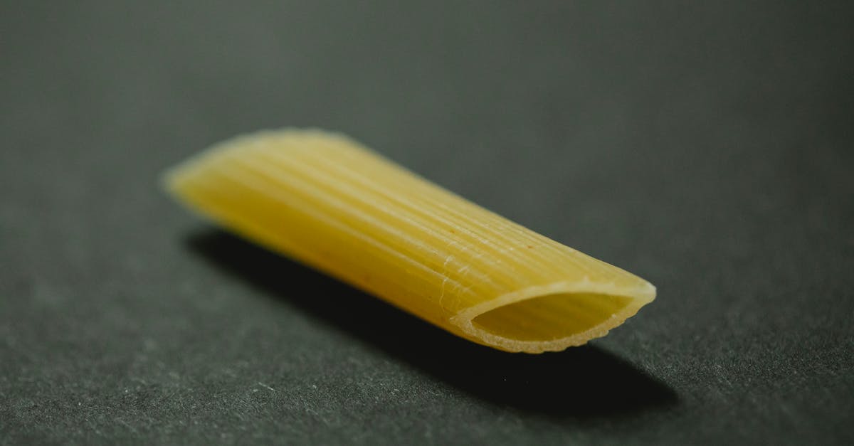 How does one go about marking food in an oven? - Raw penne for making dish on table