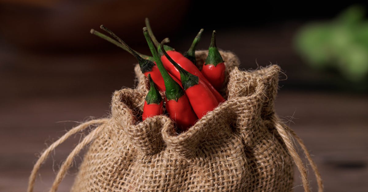 How does one tell if a jalapeno is spicy? - Close-Up Shot of Red Chilli Peppers