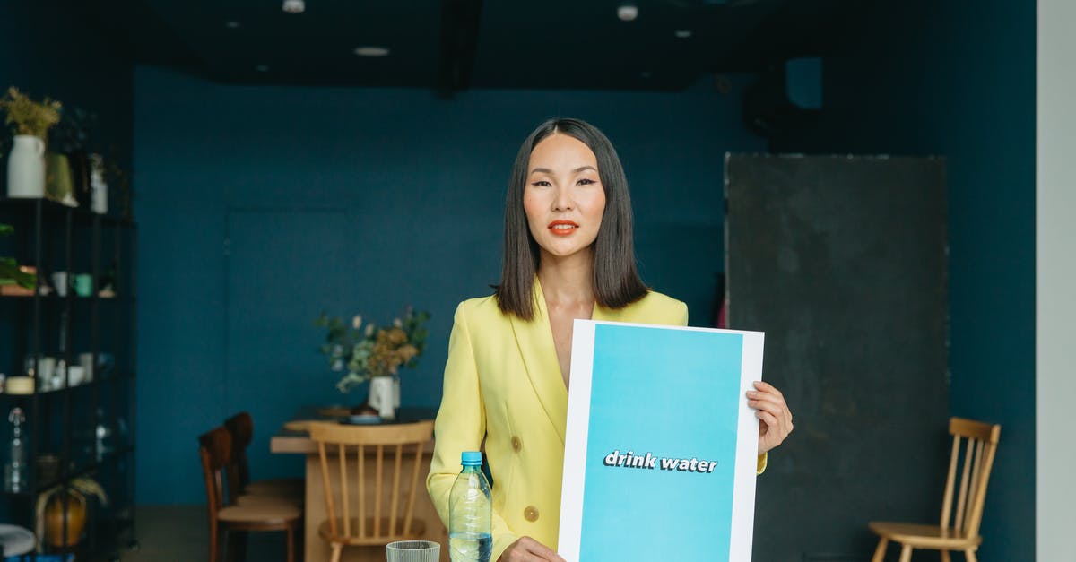 How does "Infra-red" frying work? - Woman in Yellow Long Sleeve Shirt Holding Blue Paper