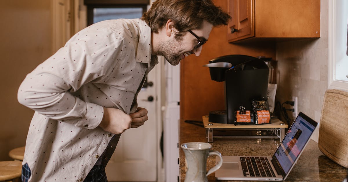 how does turbo chef oven work and technology in it? - Man in White Dress Shirt Pouring Water on Clear Glass Mug