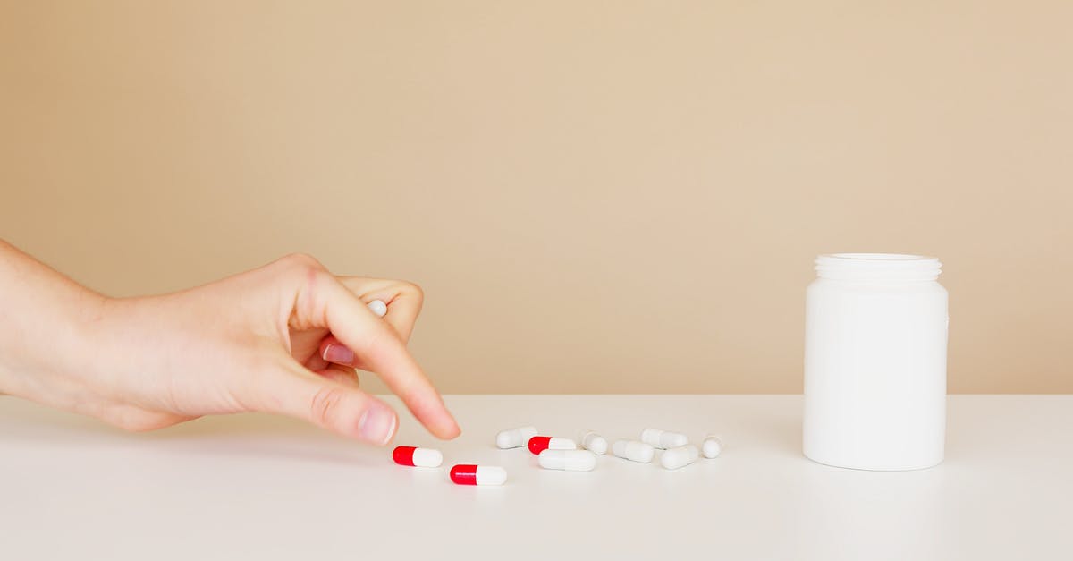 How does vacuum sealing something in a mason jar help? - Crop patient taking pill from table