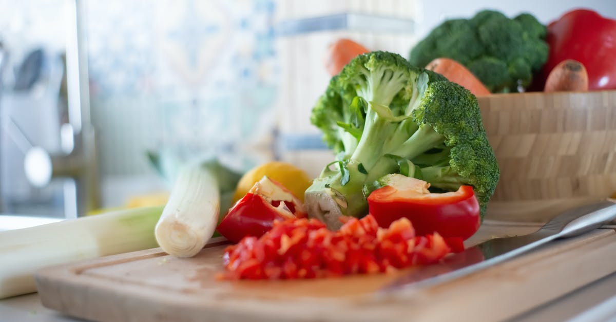 How finely chopped should vegetables be when making stock? - Chopped Red Bell Pepper on Wooden Chopping Board 