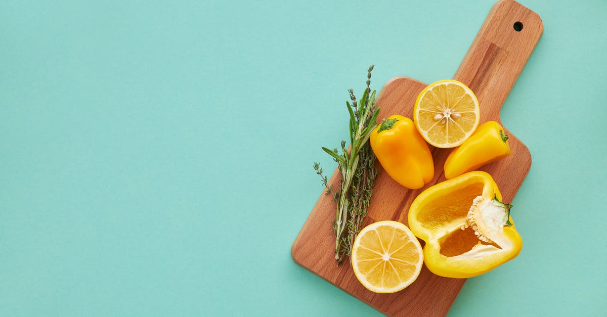 How finely chopped should vegetables be when making stock? - Sliced Orange Fruit on Chopping Board