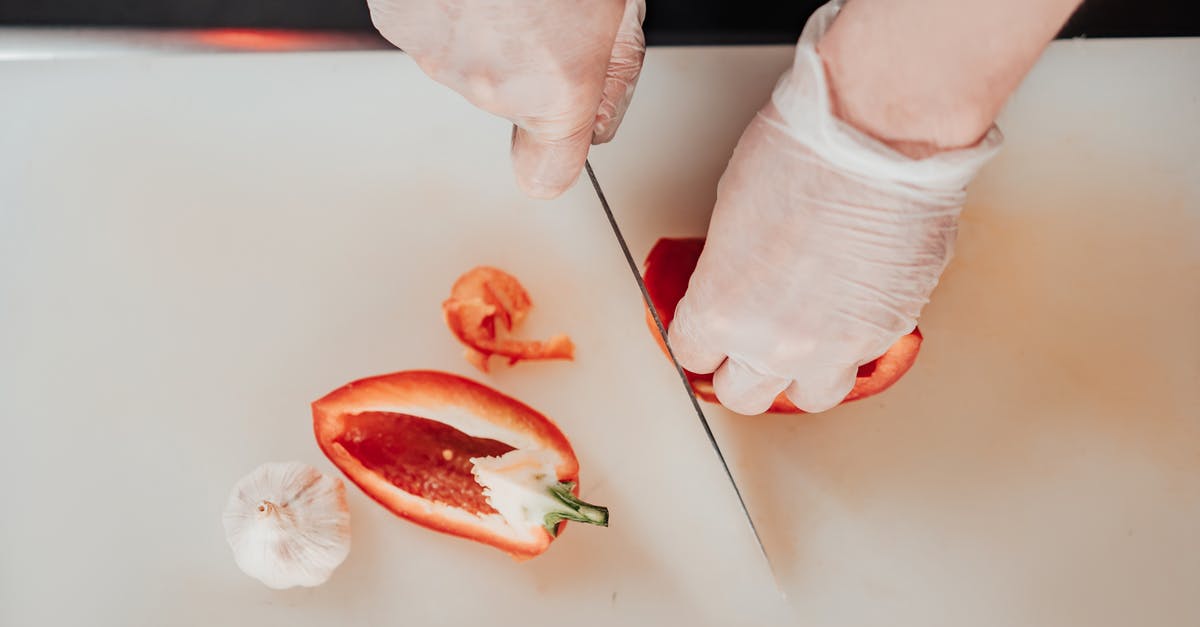 How heavy should a Chinese chef's knife be? - Person Holding Sliced of Watermelon