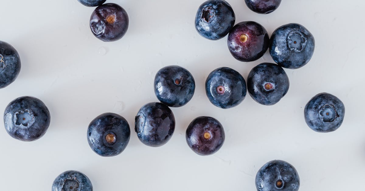 How is one meant to treat fenugreek seeds? - Top view of delicious ripe and sweet blueberry randomly scattered on white surface