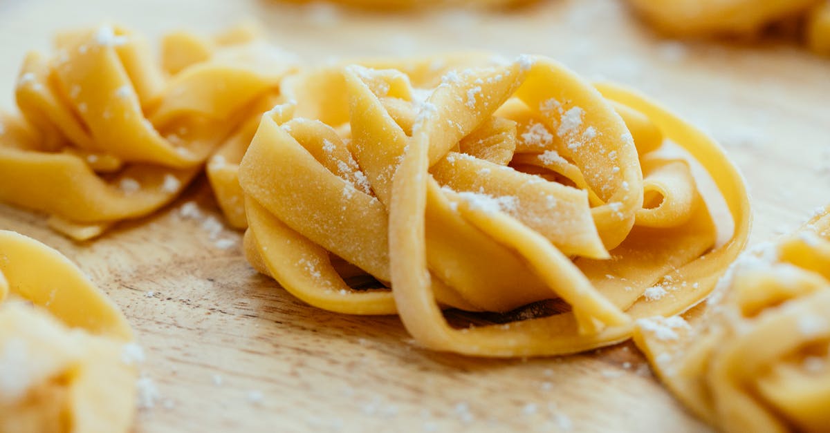 How Long Before an Egg Starts to Stink? - Homemade long noodles made with egg dough on table