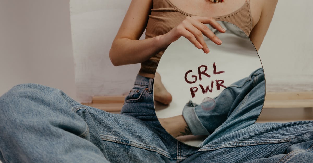 How long can I hold brown rice between boiling and steaming? - Woman in Brown Tank Top and Blue Denim Jeans Holding Round Mirror