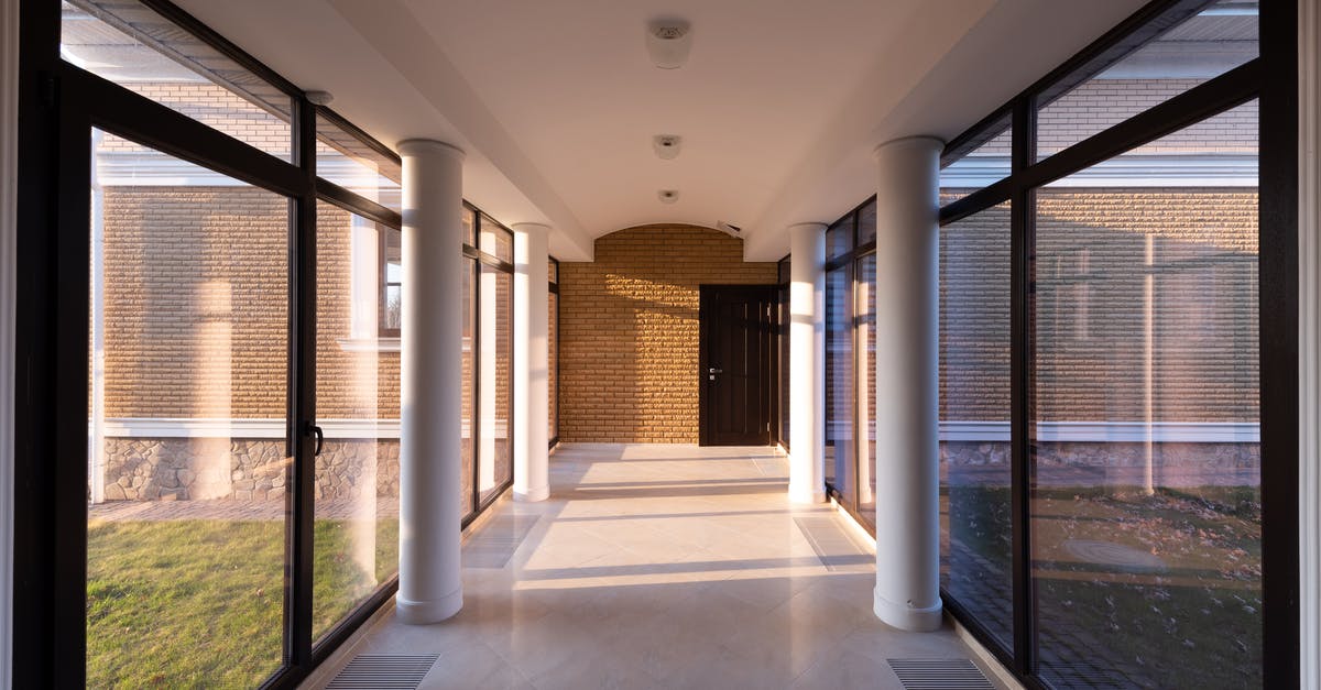 How long can I keep green curry paste? - Corridor of modern building with glass walls