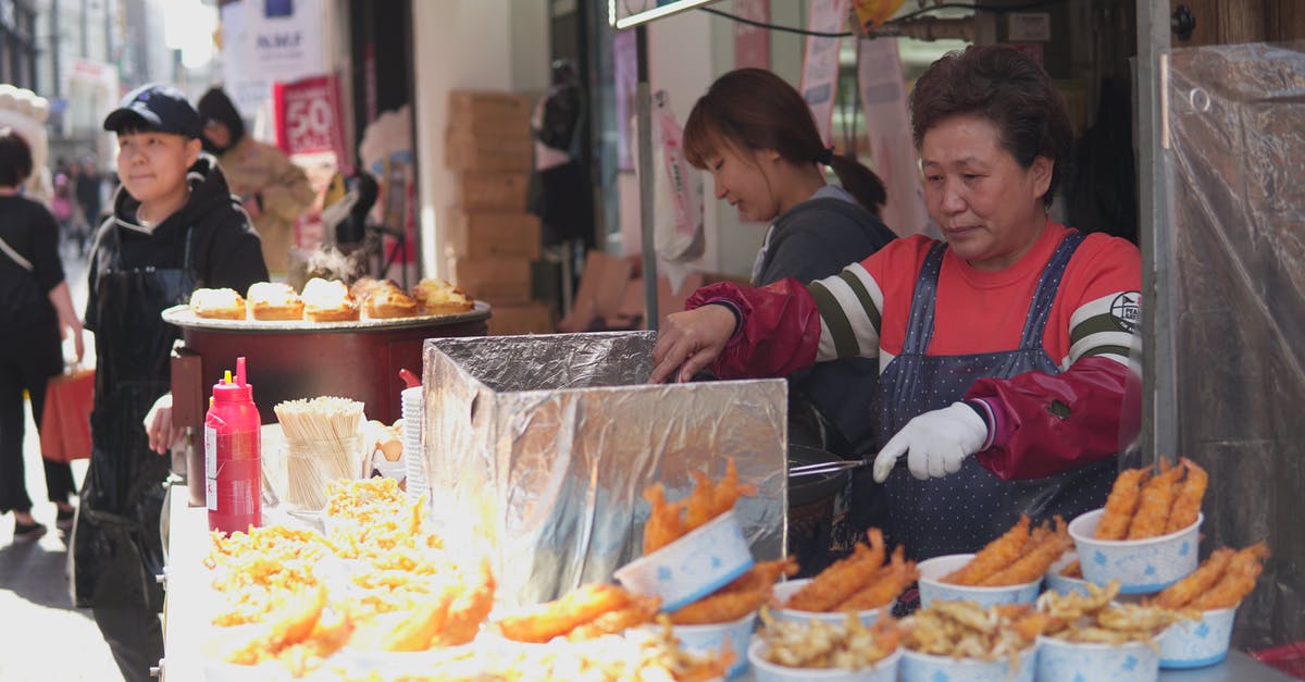 How long can I store cooking wine? - Woman Cooking in a Food Stand