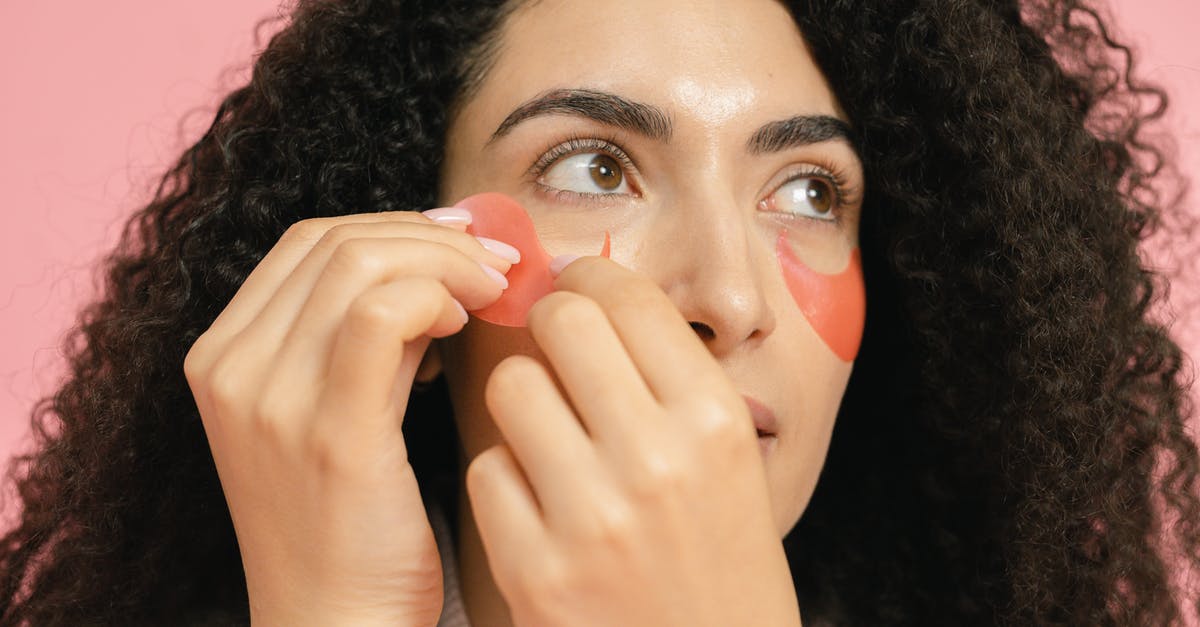 how long can you keep uncooked lentils - red and brown - Woman putting on red cosmetic pads under her eyes
