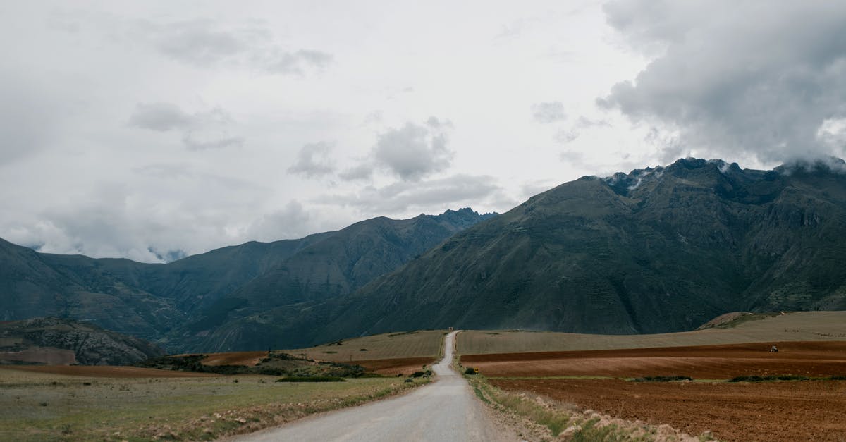 How long do oven elements last under high usage? - Empty road leading towards high mountains with clouds above