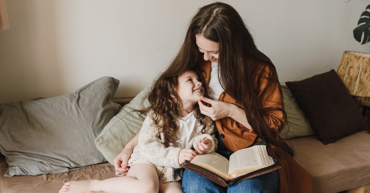 How long does bicarbonate soda (baking soda) keep? - A Woman and a Child Sitting on a Couch With Throw Pillows