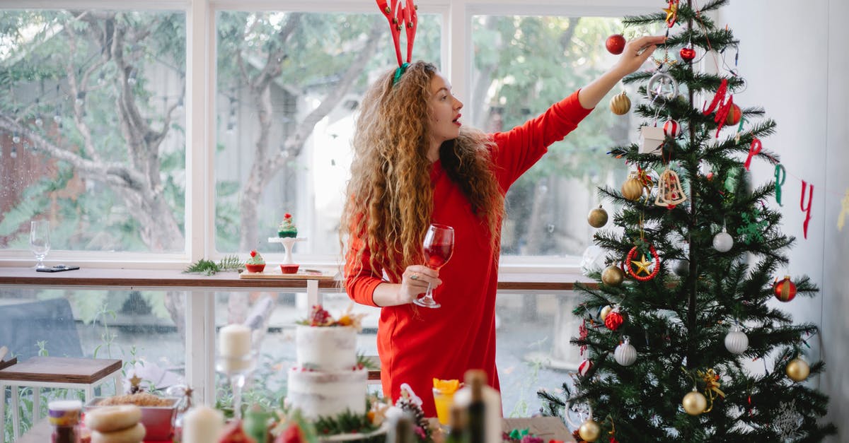 How long does Marsala wine last, after opening? - Woman in headband with reindeer decorating Christmas tree