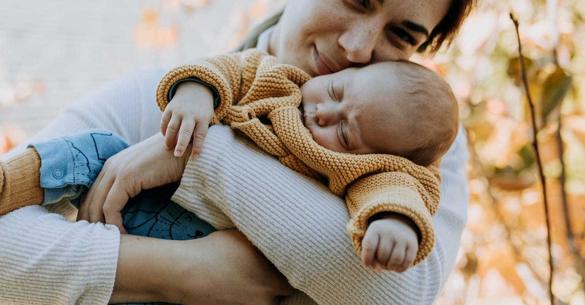 How long should I blanch baby peas? - Woman Hugging her Sleeping Baby