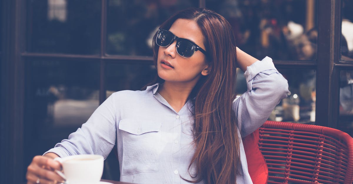 How long should I let a tea with lemongrass steep? - Portrait of Young Woman Drinking Coffee at Home