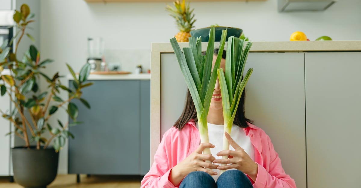 How long to keep defrosted vegetables in the fridge - Person in Pink Long Sleeve Shirt and Blue Denim Jeans Sitting on Floor