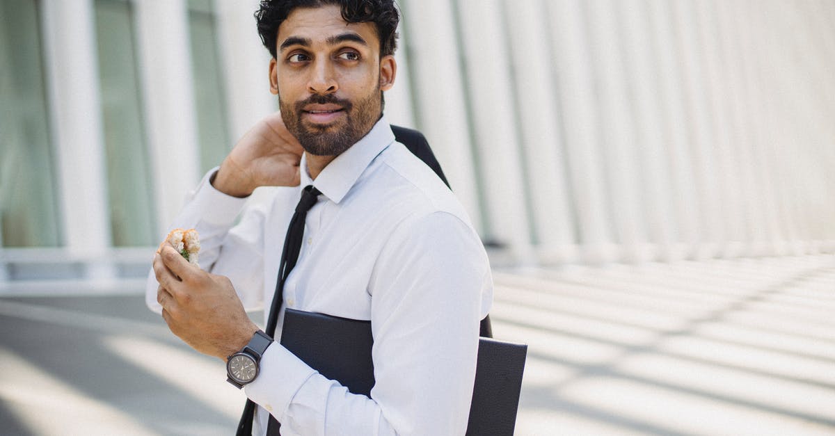 How long will a peanut butter sandwich last? - 

A Bearded Man in a Corporate Attire Holding a Sandwich