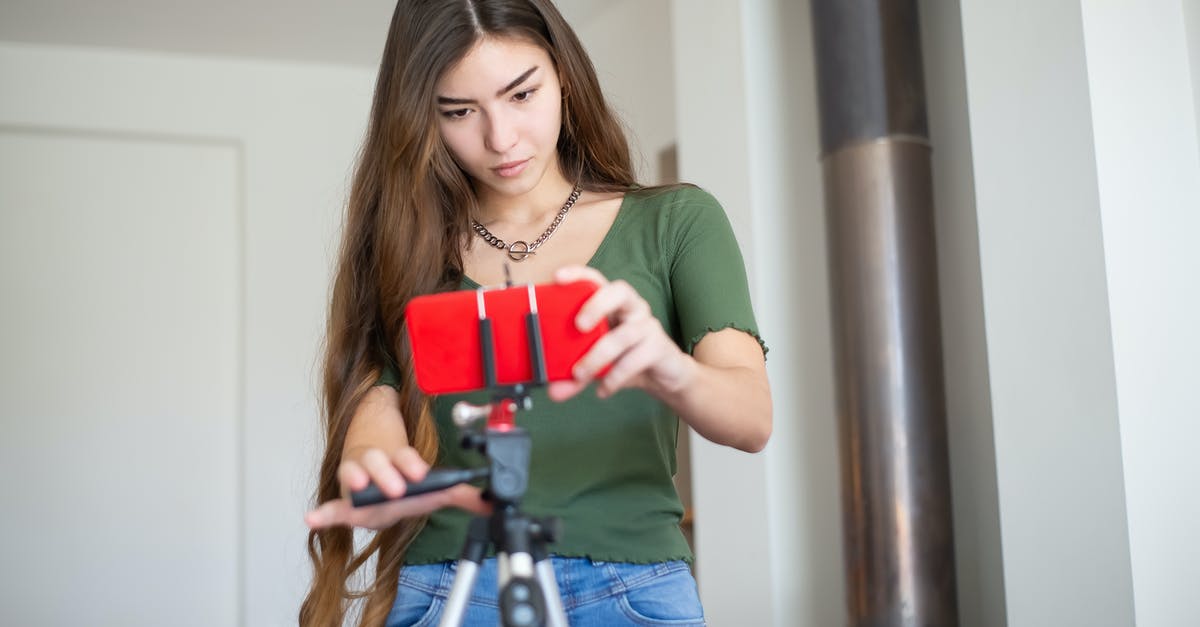 How long will live lobsters last in the fridge? - Woman Arranging the Smartphone on a Tripod 