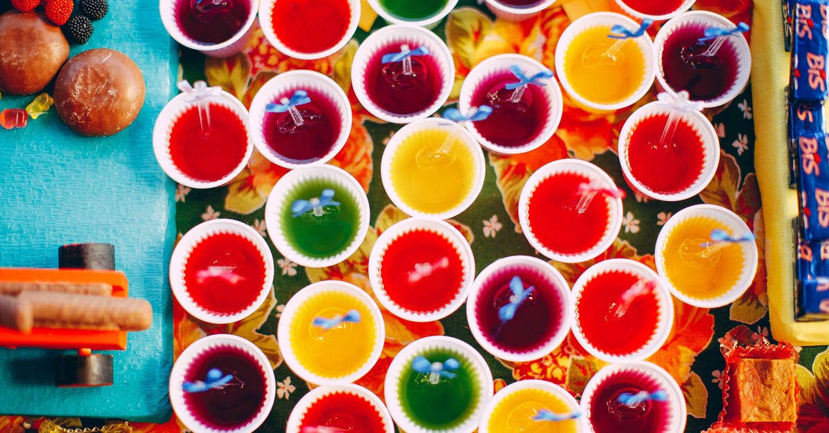 How many calories are in a cup of rice? - Top view of various delicious assorted desserts in white cups placed on table