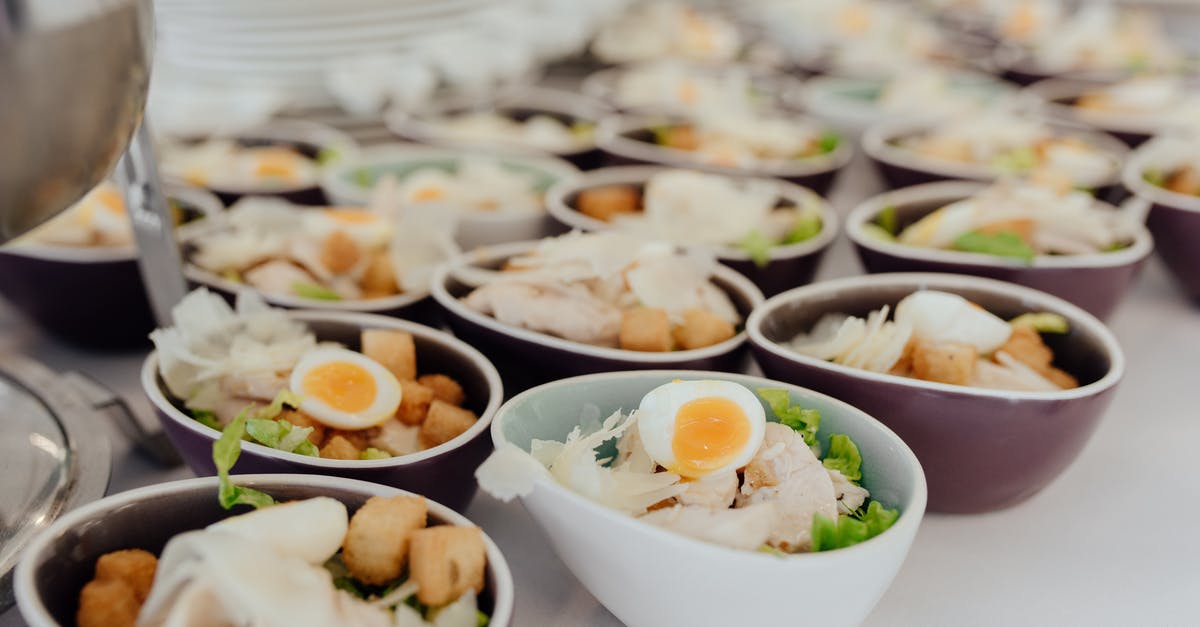 How many times can you reheat boiled eggs? - Bowls with salad on buffet table