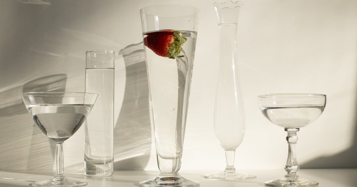 How much alcohol remains in strawberries soaked in alcohol? - Various glass of cocktails on white table