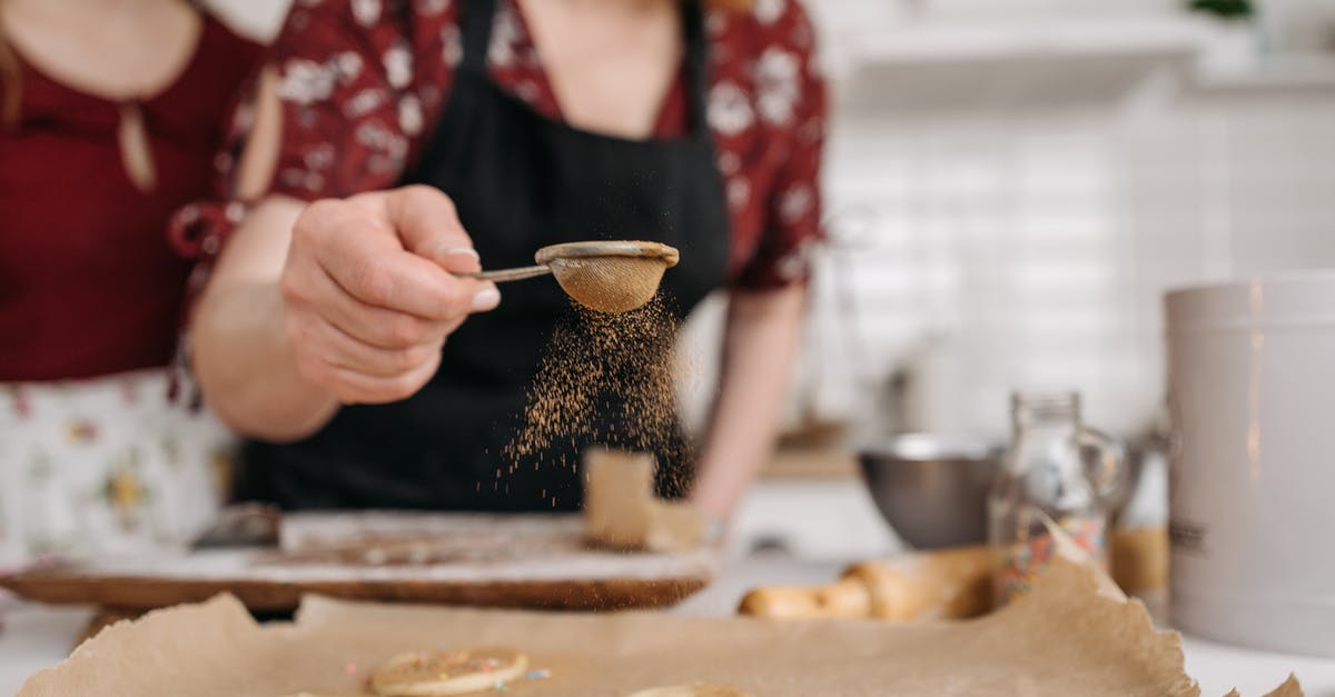 How much baking powder or soda can I add to cookies without the taste being affected? - A Person Holding a Small Sifter with Brown Powder How much baking powder or soda can I add to cookies without the taste being affected? - A Person Holding a Small Sifter with Brown Powder
