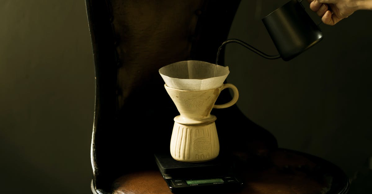 How much does a cup of hazelnuts weigh? - White Ceramic Coffee Dripper  on Brown Wooden Chair